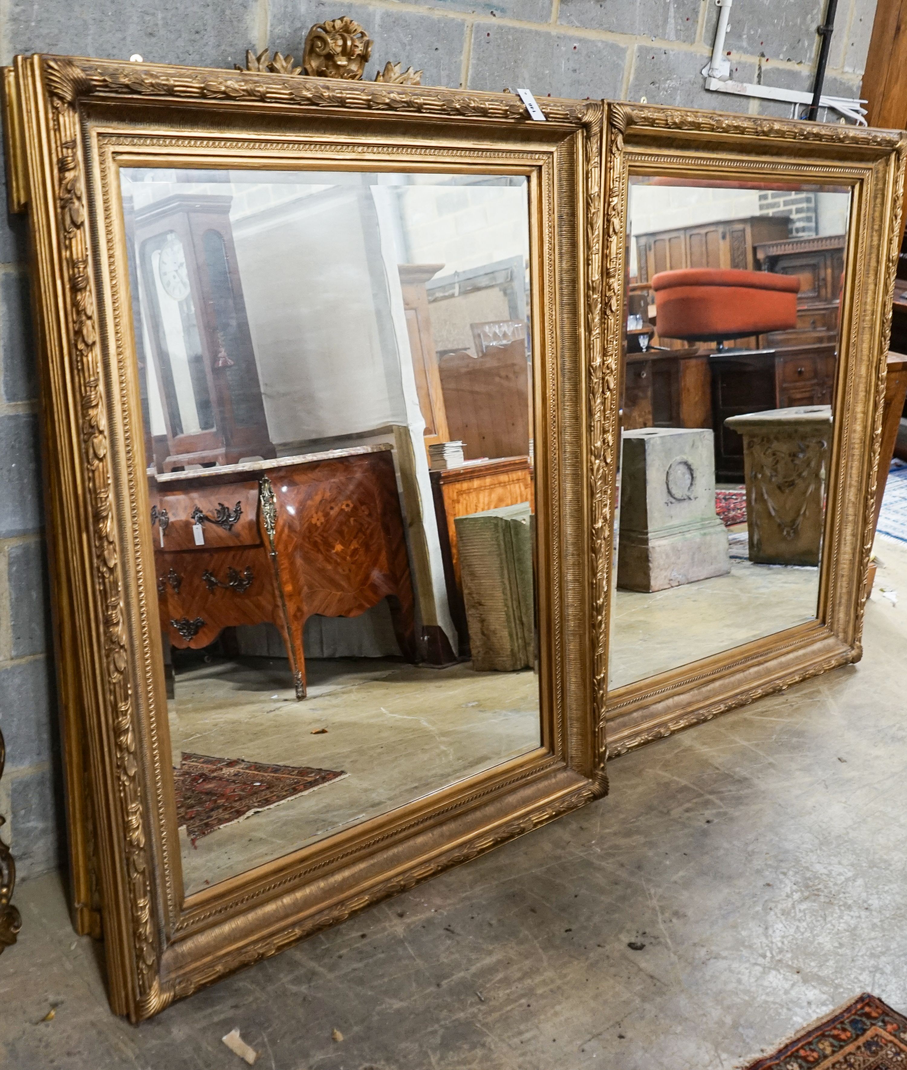 A pair of Victorian style rectangular gilt framed wall mirrors, width 118cm, height 150cm